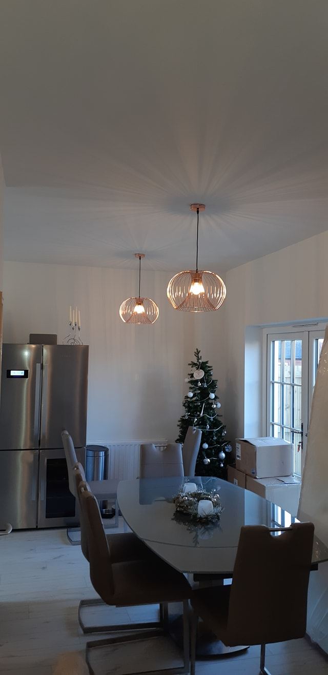 Decorative light fitttings replaced in a dining room in a new build